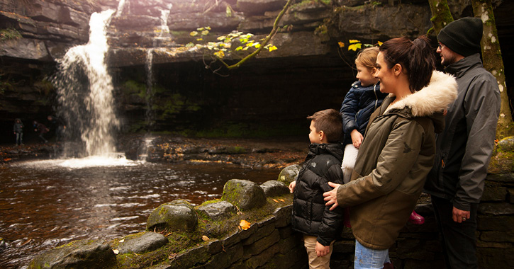 family stood admiring Gibson's Cave in the Durham Dales and North Pennines AONB